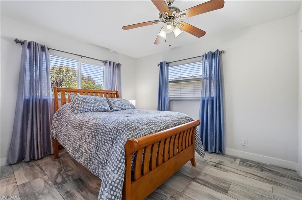 Bedroom featuring light wood-style flooring and a ceiling fan