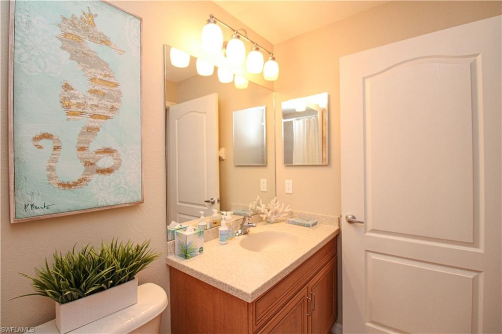 Bathroom with toilet and vanity