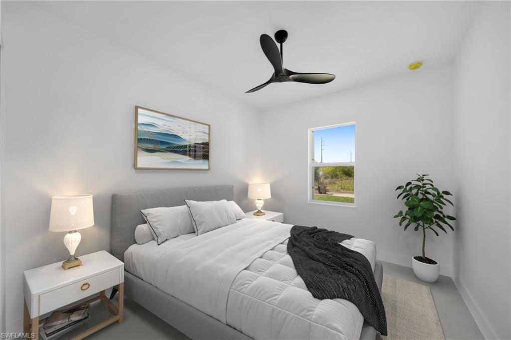 Bedroom featuring baseboards and ceiling fan