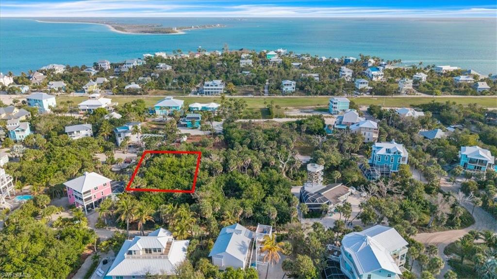 Aerial view of lot (outlined in red) nestled among established island homes — just a short walk to the North Captiva airstrip and surrounded by the island's most desirable residential neighborhood.