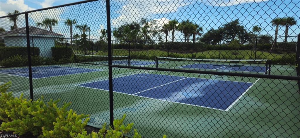 View of sport court with a tennis court