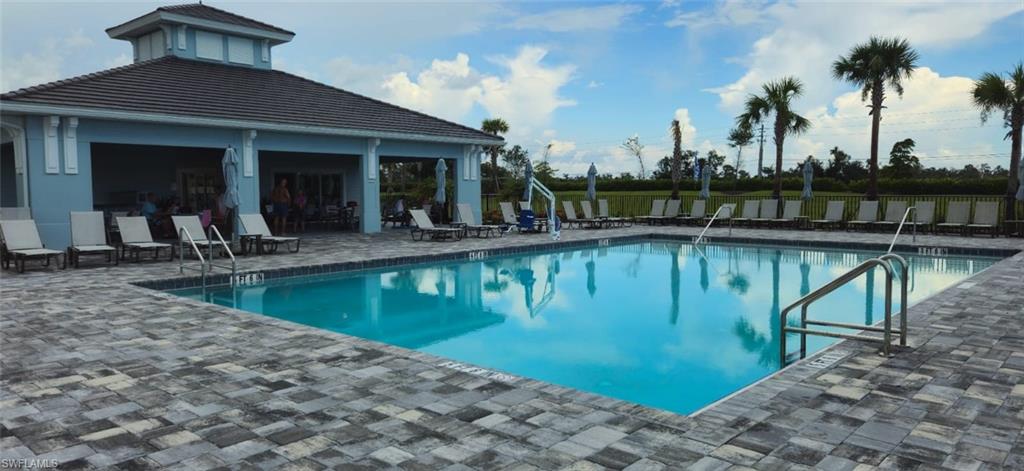Community pool featuring a patio