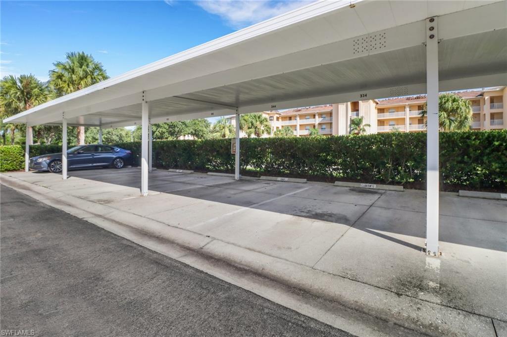 View of car parking featuring a carport