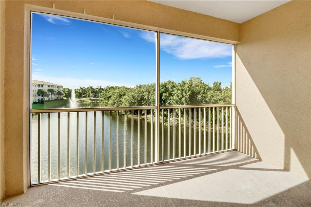 Unfurnished sunroom with a water view