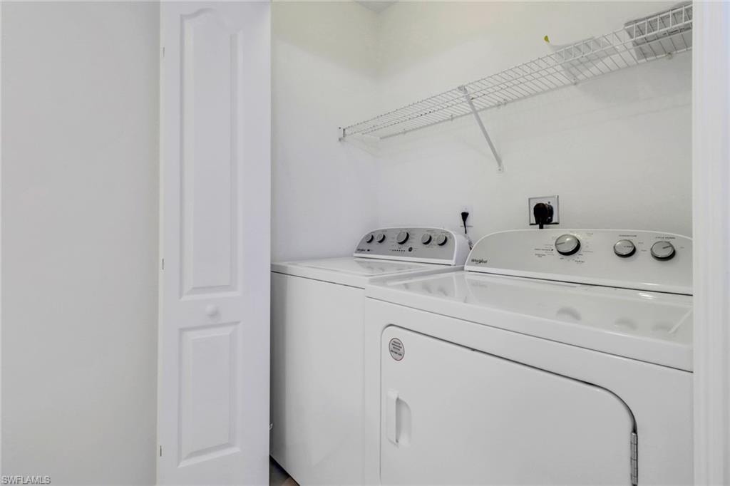 Clothes washing area featuring independent washer and dryer