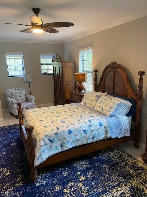 Bedroom featuring ceiling fan and crown molding