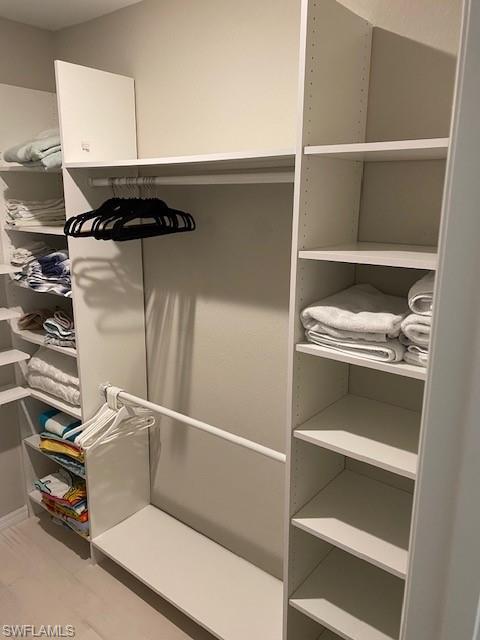 Walk in closet featuring light hardwood / wood-style flooring