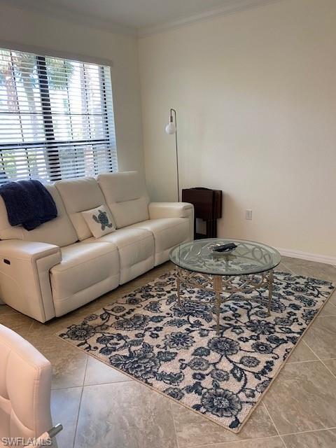 Tiled living room with ornamental molding