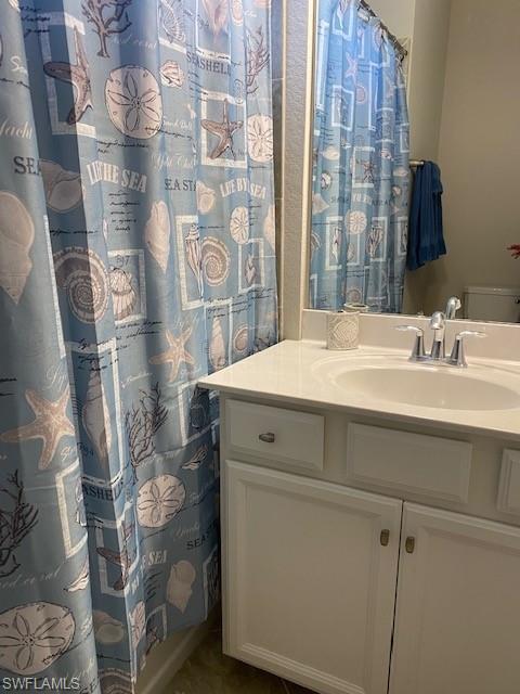 Bathroom with oversized vanity and toilet