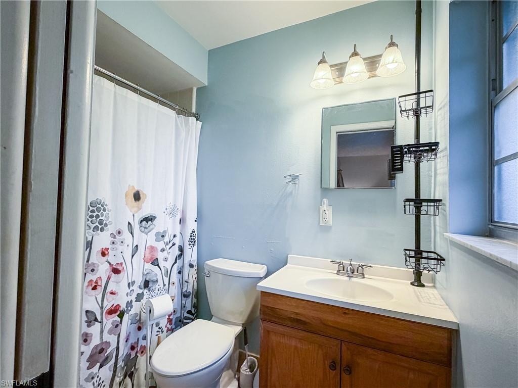 Master bathroom with vanity and a shower.