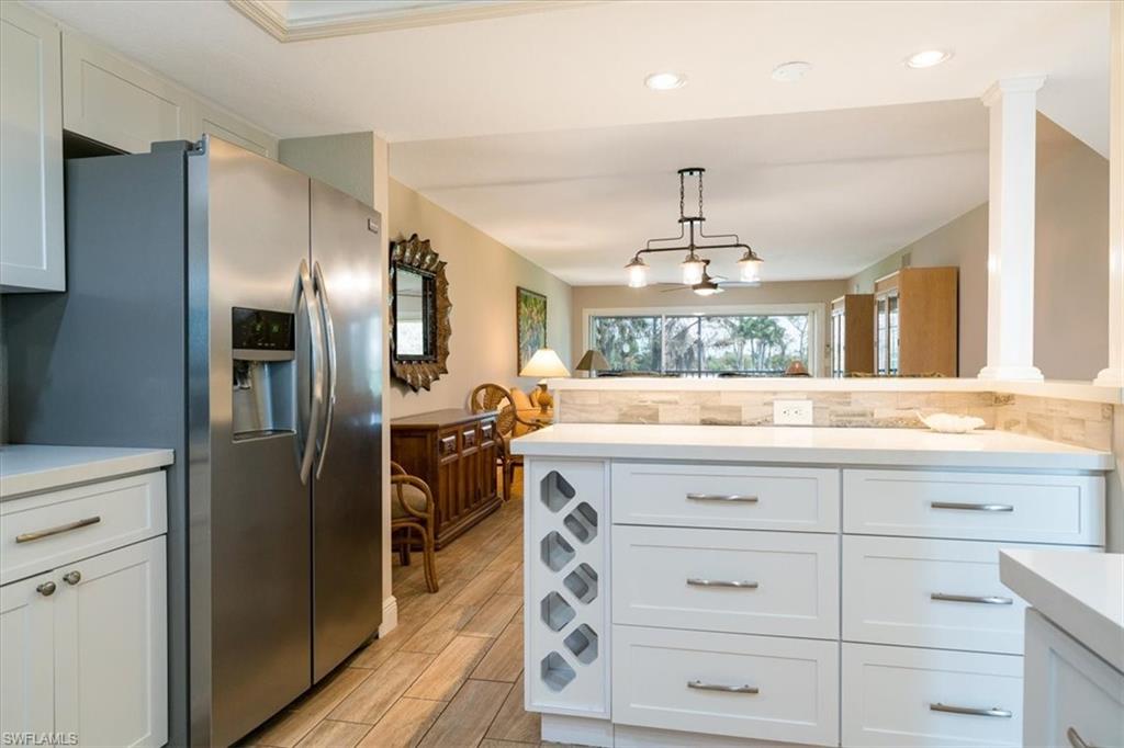 Open Floor Plan with breakfast bar with built in wine rack