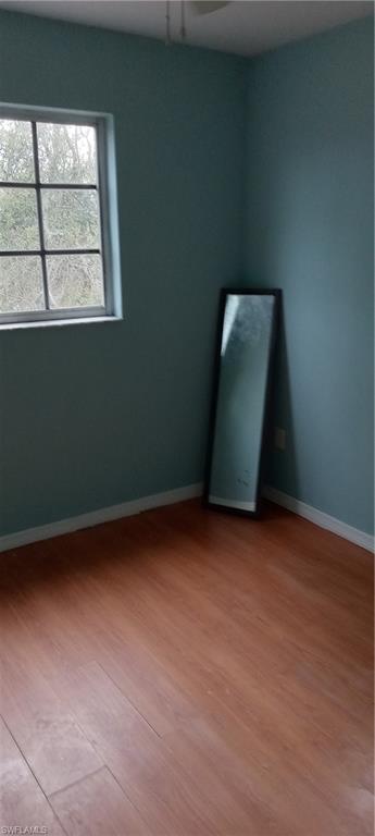 Empty room featuring light wood-style floors and baseboards