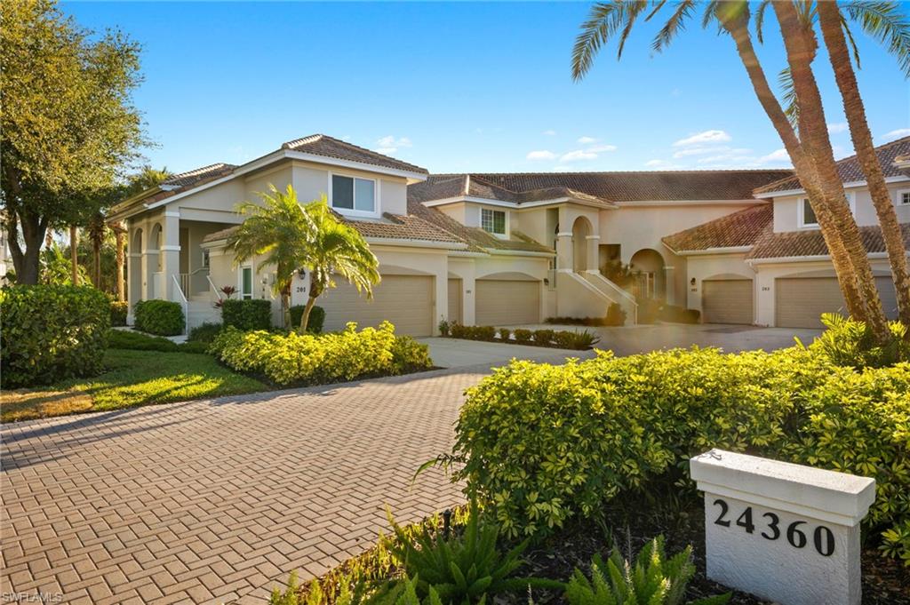 View of front of home featuring driveway, an attached garage, and stucco siding