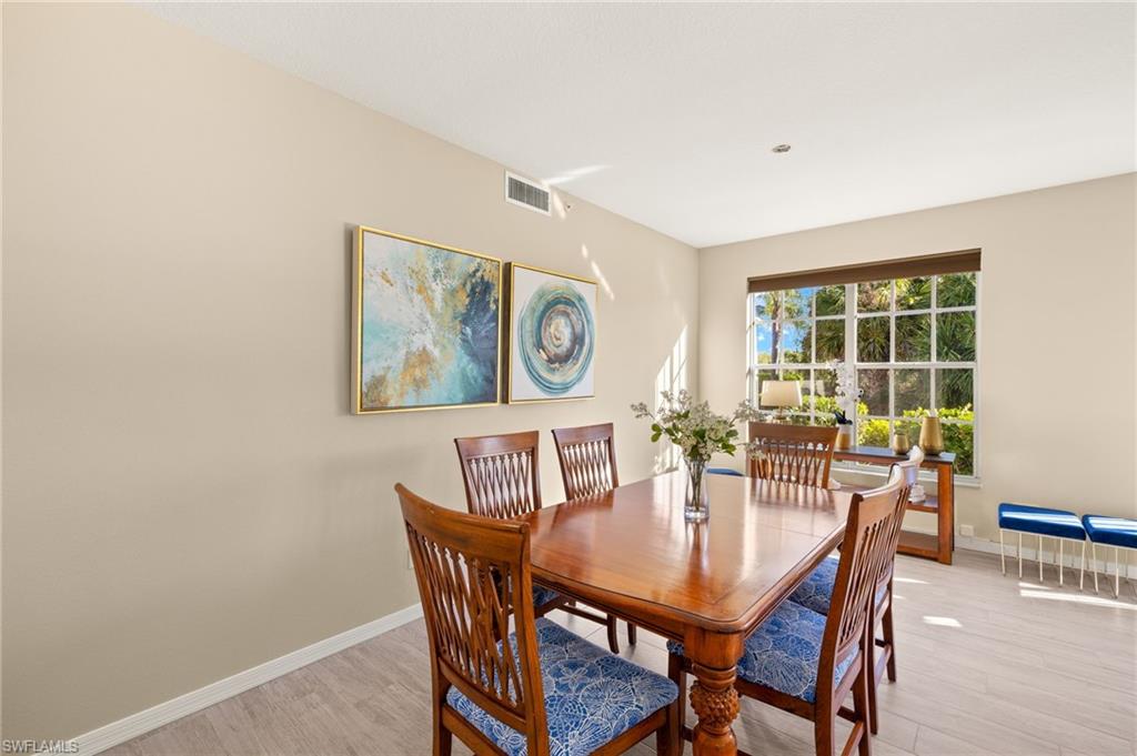Dining room featuring light wood finished floors and baseboards