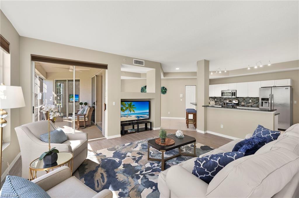 Living room featuring light wood finished floors and baseboards