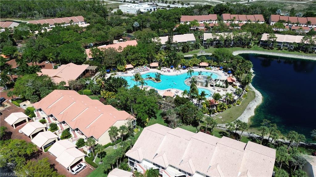 Aerial perspective of suburban area featuring a pool area
