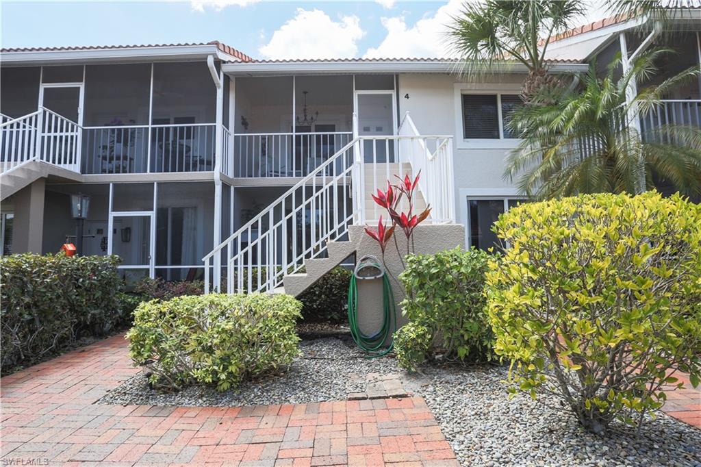 View of apartment building / complex with stairway