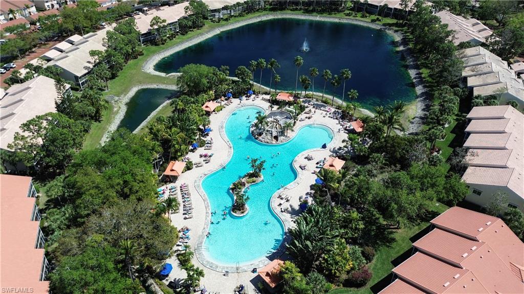 Aerial view of a nearby body of water and a pool area