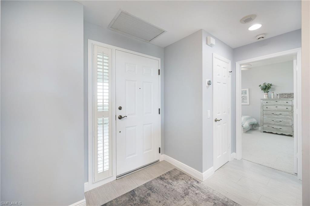 Foyer entrance with baseboards
