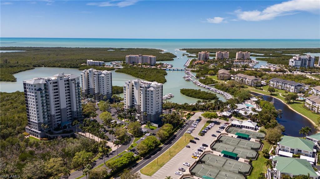 View of urban area featuring a nearby body of water and apartment complex / building