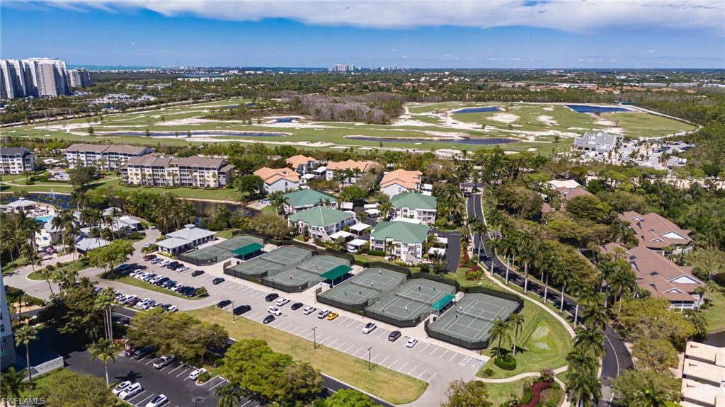 Aerial view of a nearby body of water and a local golf course