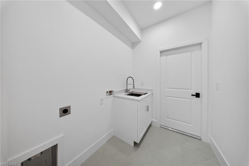 Laundry room with washer hookup, cabinet space, electric dryer hookup, and recessed lighting