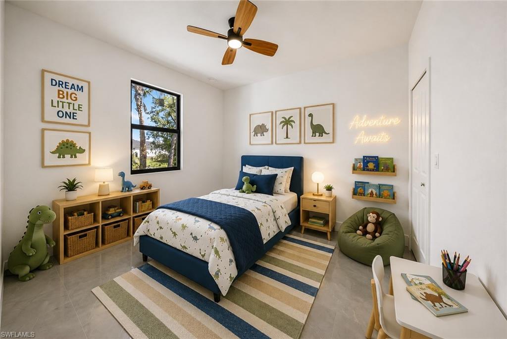Bright room featuring a window with black trim, a ceiling fan with wood-finish blades, light gray flooring, a built-in wall closet, and recessed wall shelving