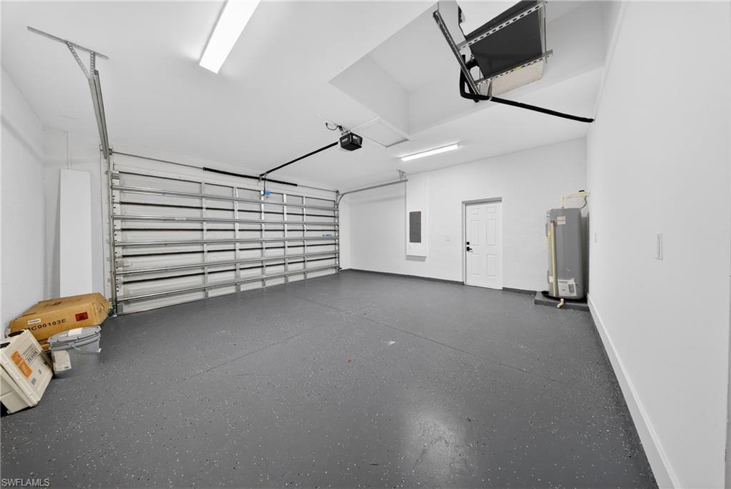 Garage with water heater and electric panel