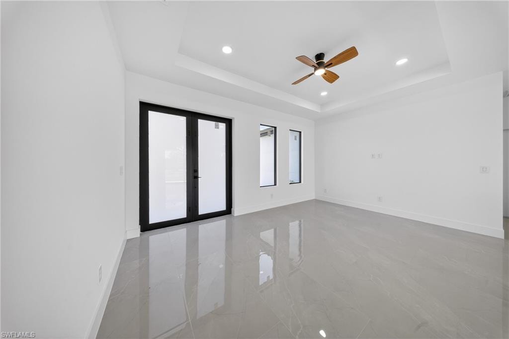 Spare room with a ceiling fan, french doors, and recessed lighting