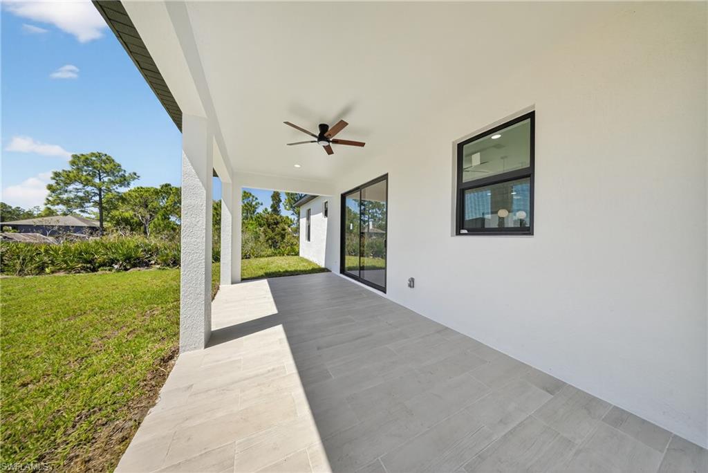 View of patio featuring ceiling fan