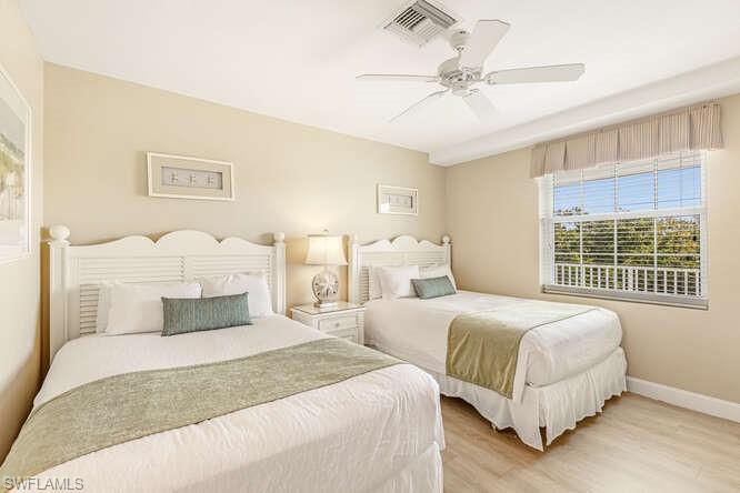 Bedroom with wood finished floors and a ceiling fan
