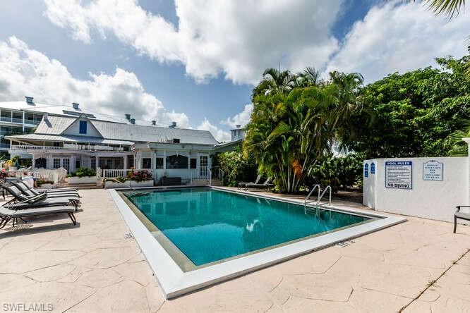 Community pool featuring a patio