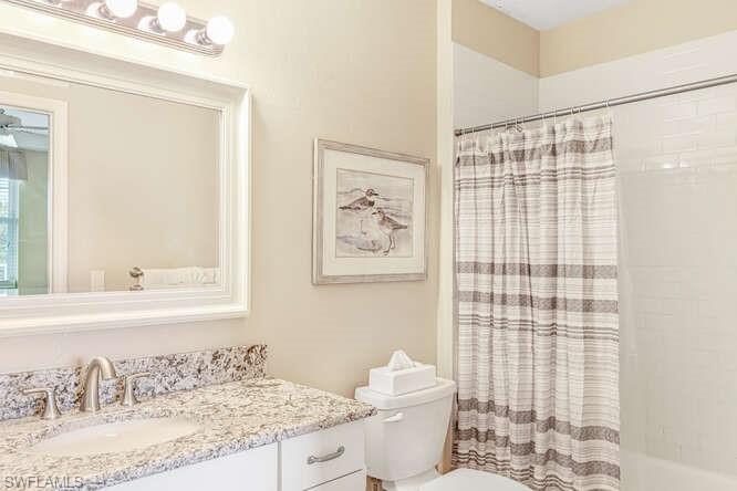 Full bath with vanity and shower / bathtub combination with curtain