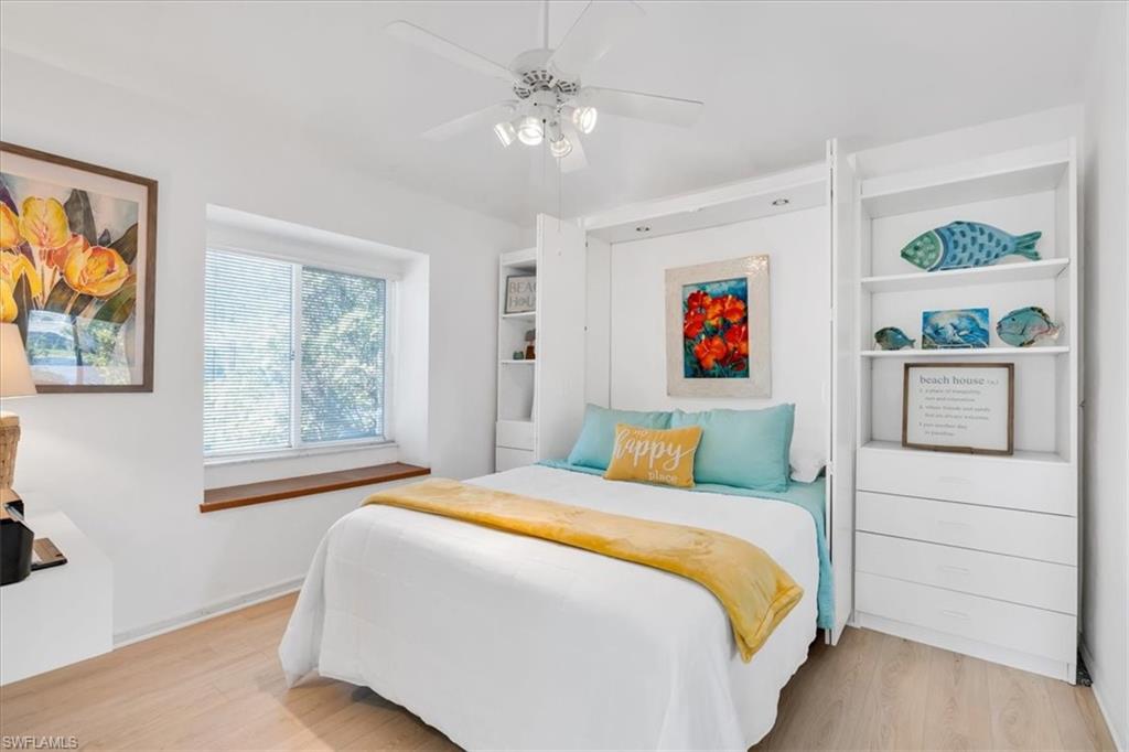 Bedroom featuring light wood-type flooring and ceiling fan