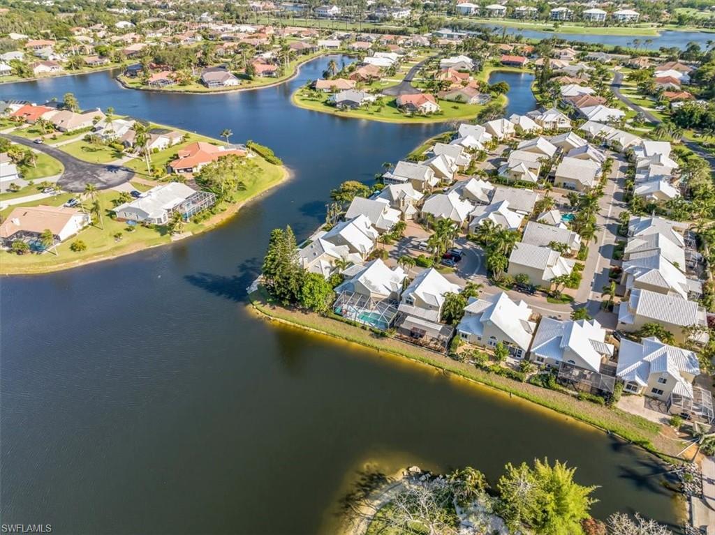 Aerial overview of property's location with a large body of water and nearby suburban area