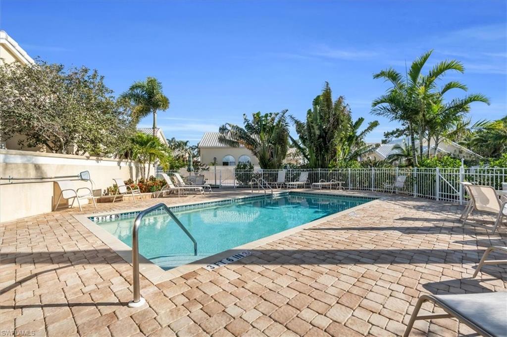 Community pool with a patio