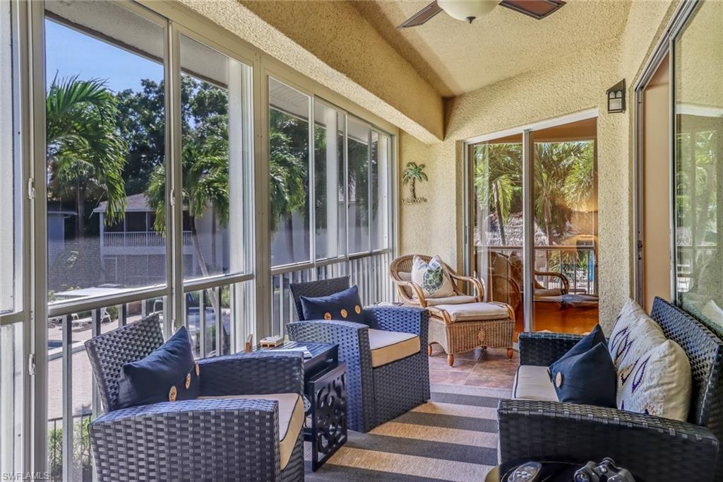 Sunroom featuring an outdoor lounge area and ceiling fan