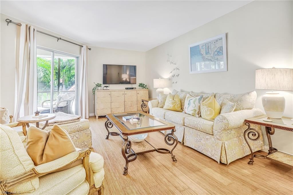 Living room with hardwood / wood-style flooring