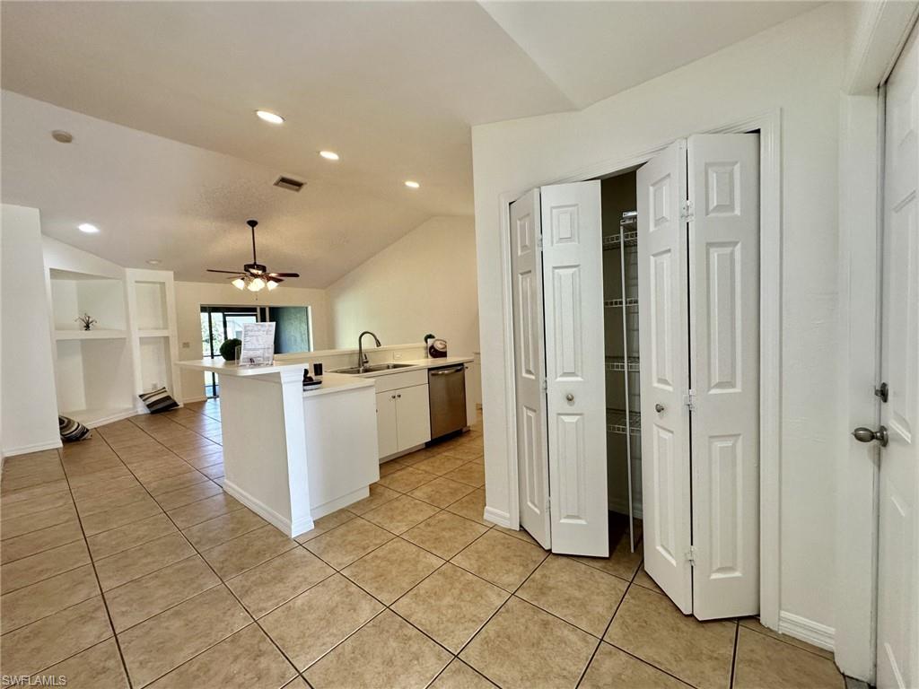 4317 Entryway to kitchen with double pantry and doorway to one car garage.