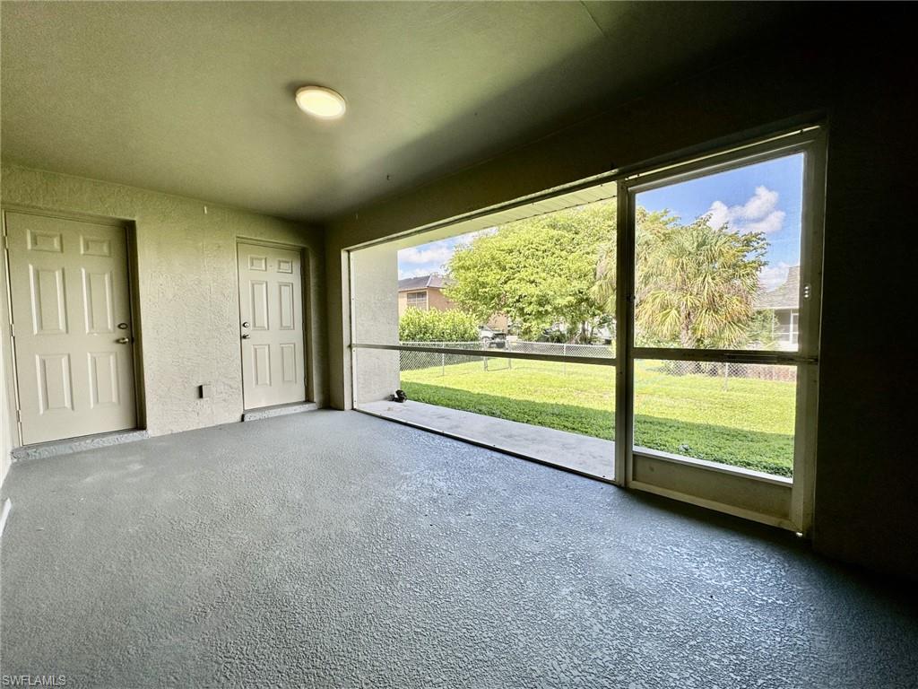 4317 Screened in lanai from pocketing slides, doorways to Primary Bath and Bedroom viewing fenced in yard