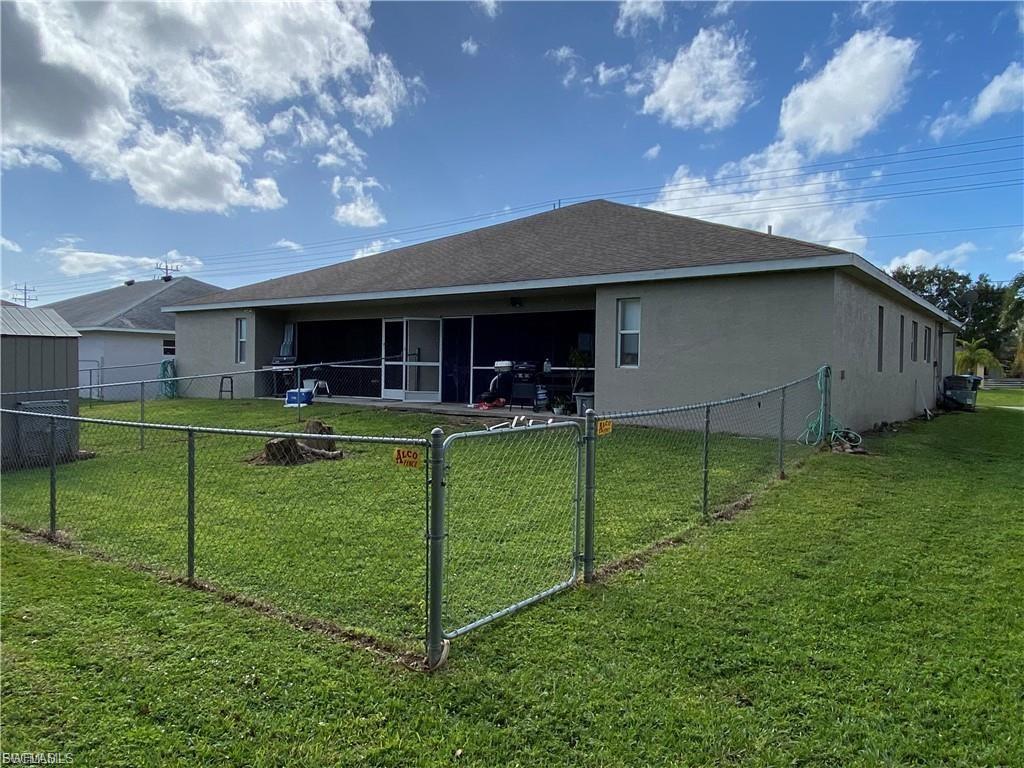View of the fenced in iew of the same presentation backyard from the 4317 duplex corner.