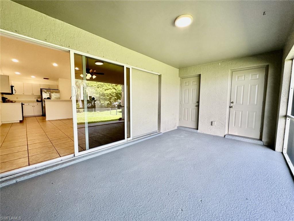4317 Screened in lanai from pocketing slides, doorways to Primary Bath and Bedroom viewing fenced in yard