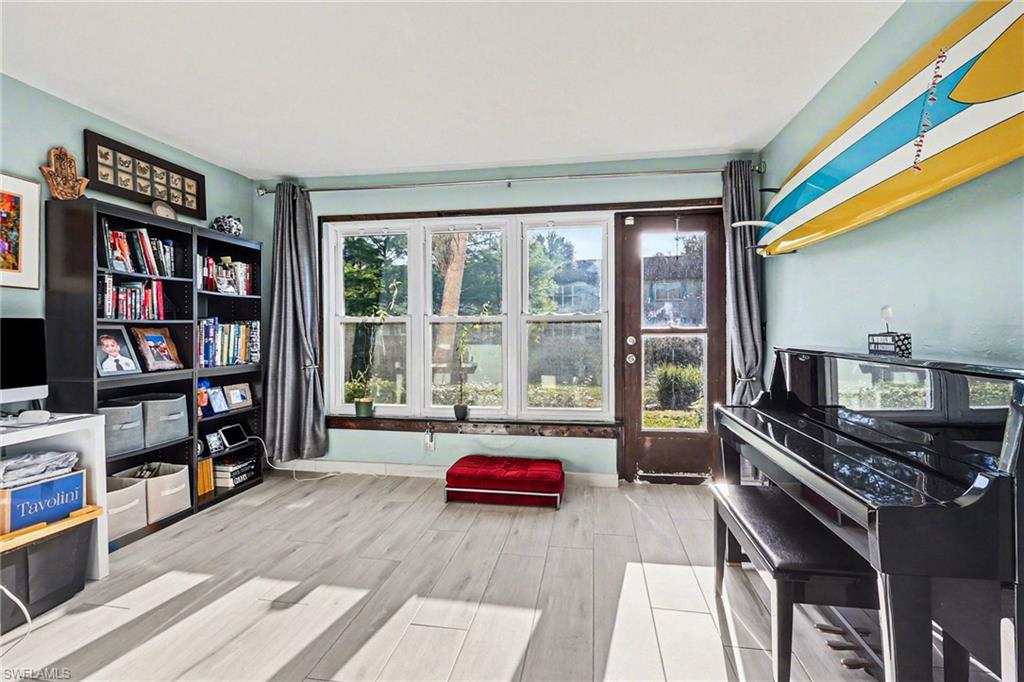 Sitting room with wood tiled floors and baseboards