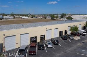 View of property featuring uncovered parking