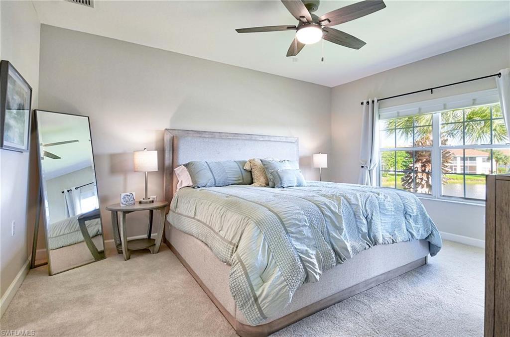 Bedroom featuring ceiling fan and light carpet