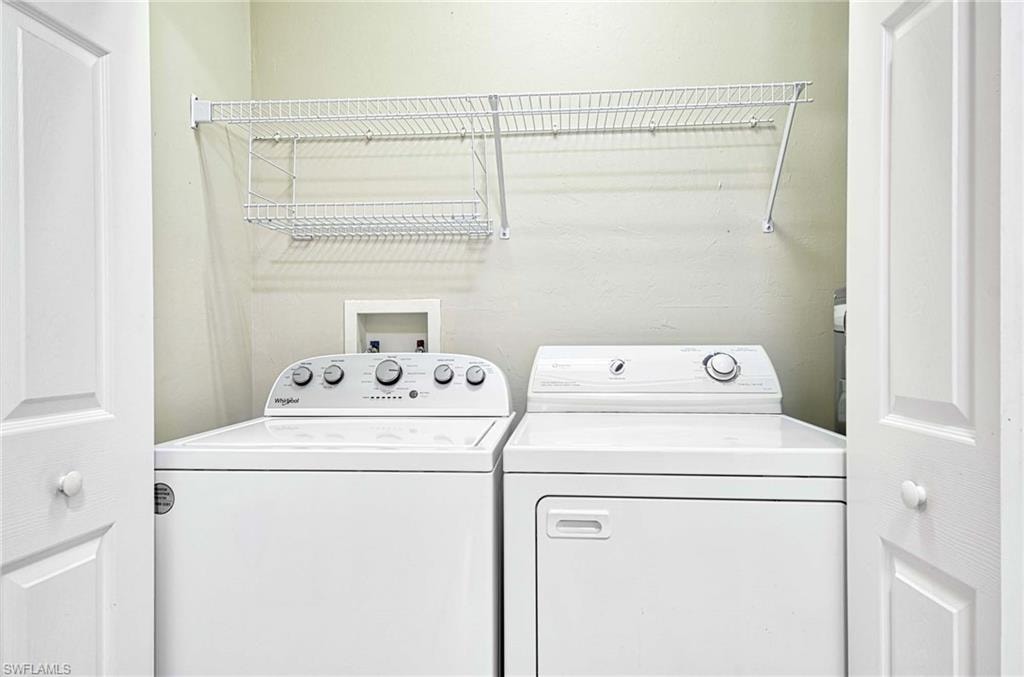Laundry area with washing machine and clothes dryer