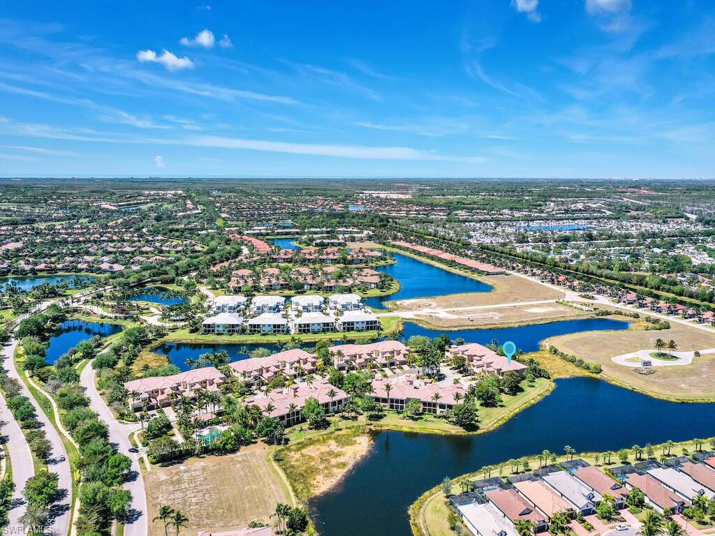 Drone / aerial view featuring a residential view and a water view