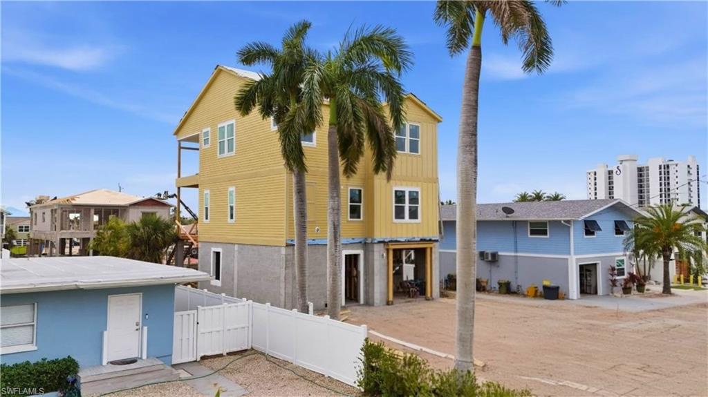 Rear view of property with a gate - Virtually Edited Image