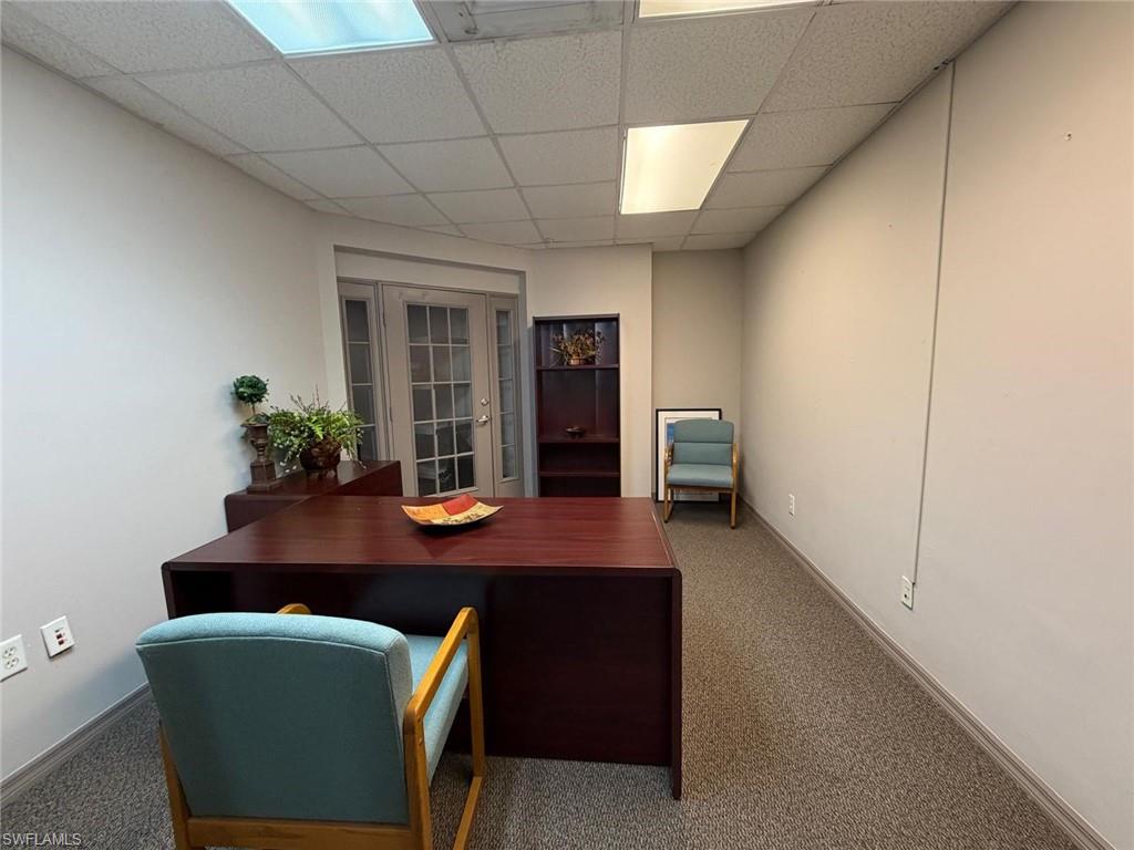 Home office with a drop ceiling and french doors