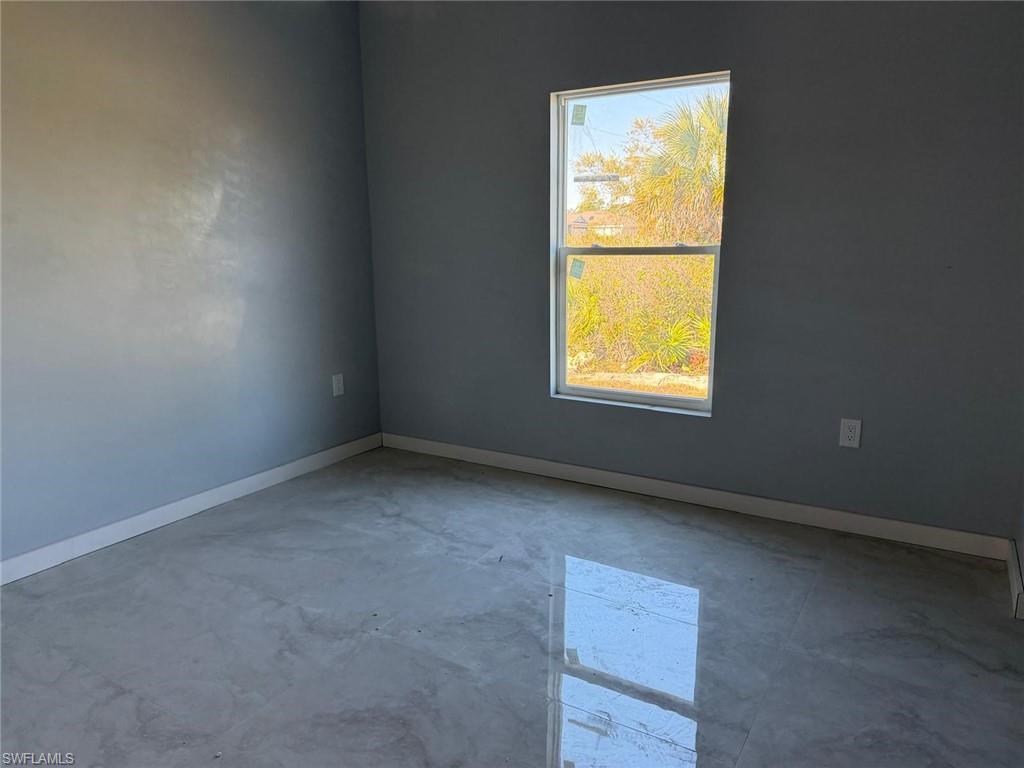 Spare room with concrete floors